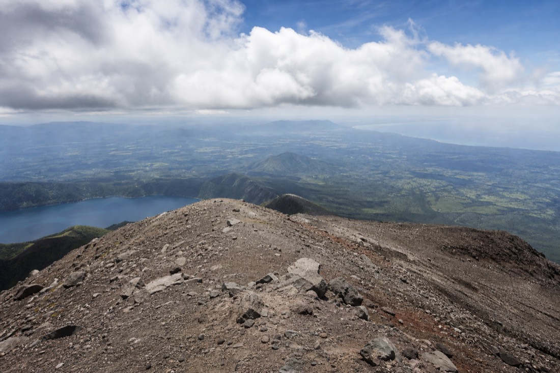 Wide view from the summit rim of Santa Ana Volcano at 2,381 metres with the Pacific haze in the distance